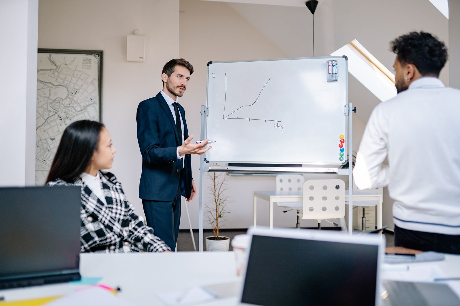A business team presenting growth graphs in an office