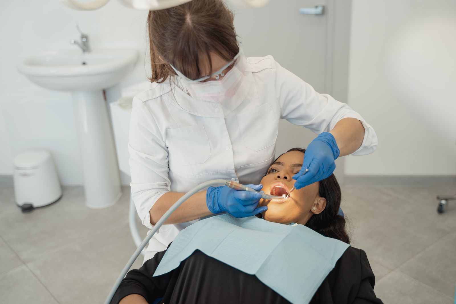 A dentist examining a patient