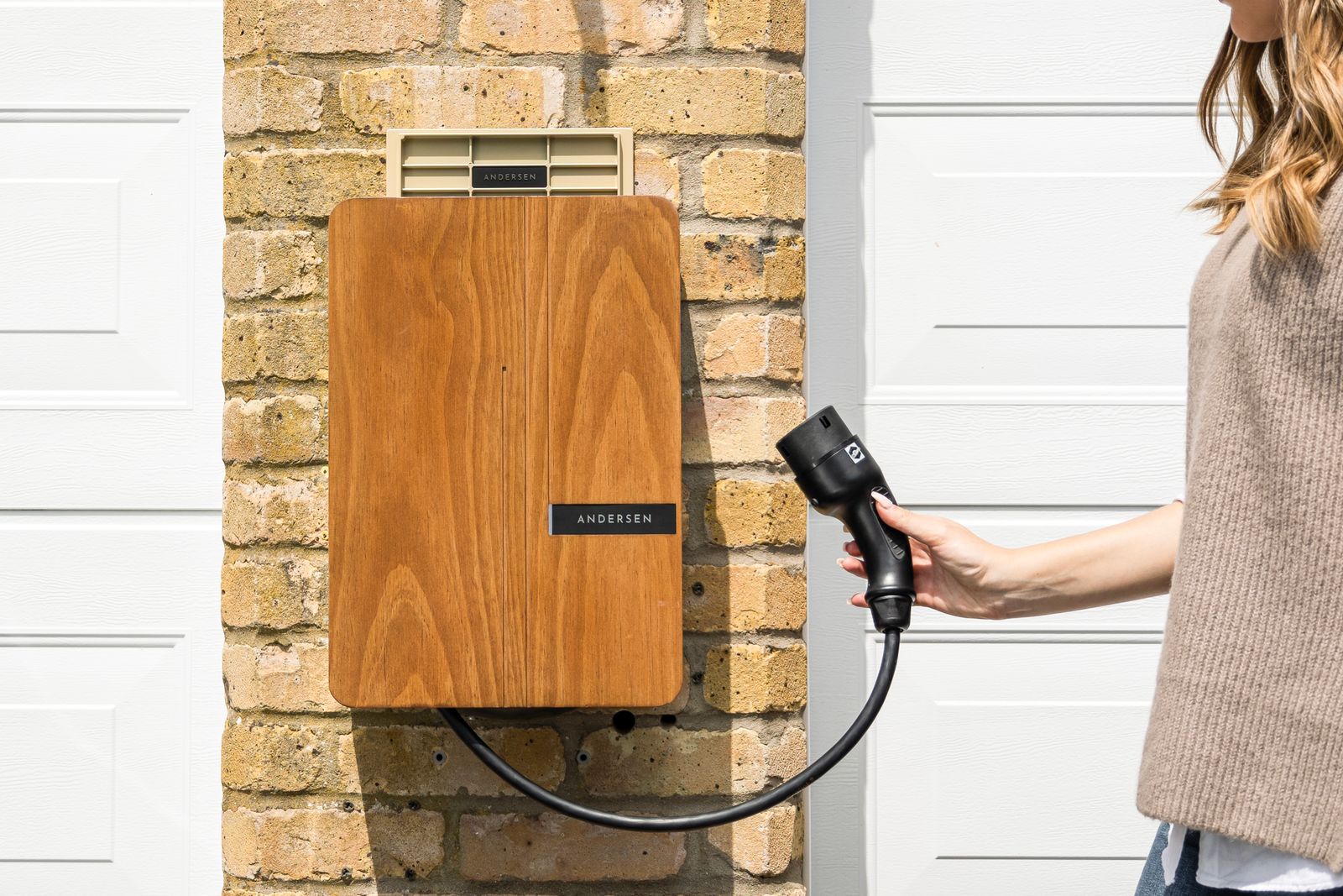 An EV home charger installed on a wall