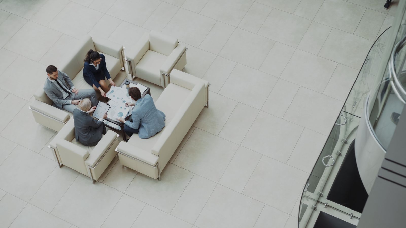 Aerial view of a business team reviewing documents