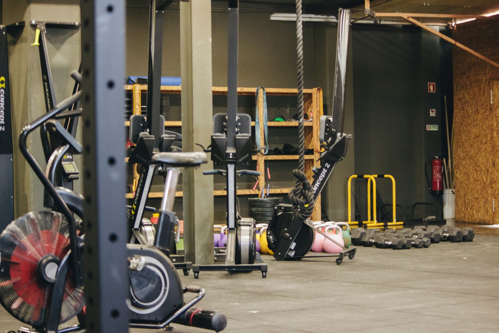 An indoor gym with weights and equipment