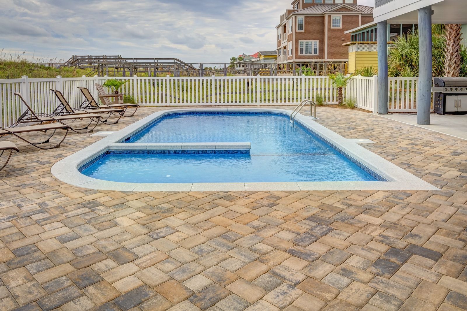 A luxury home with poolside terrace