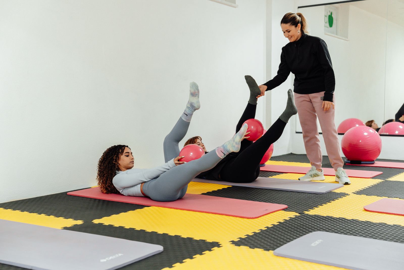 A mat Pilates class in session