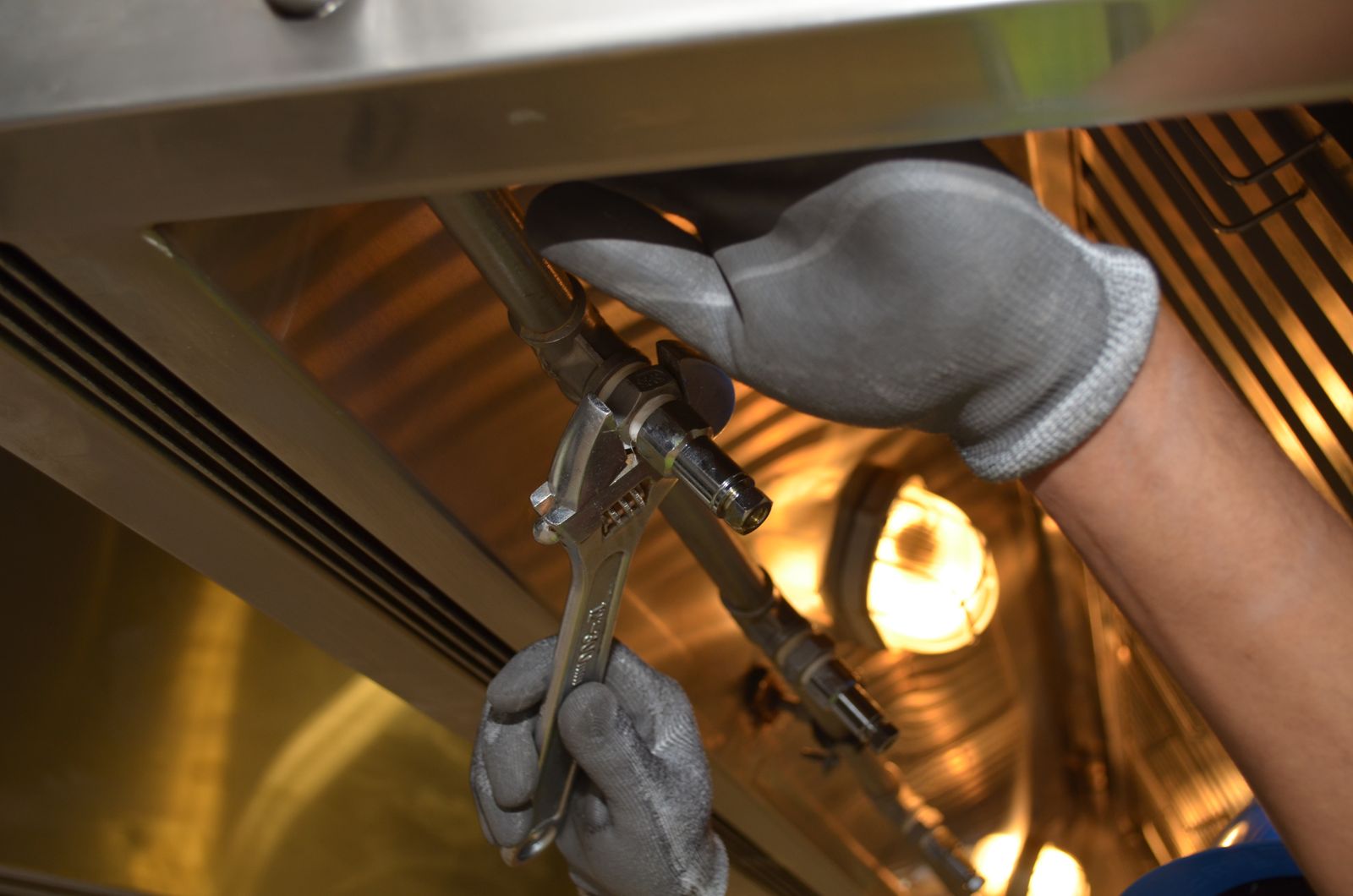 A plumber repairing pipes