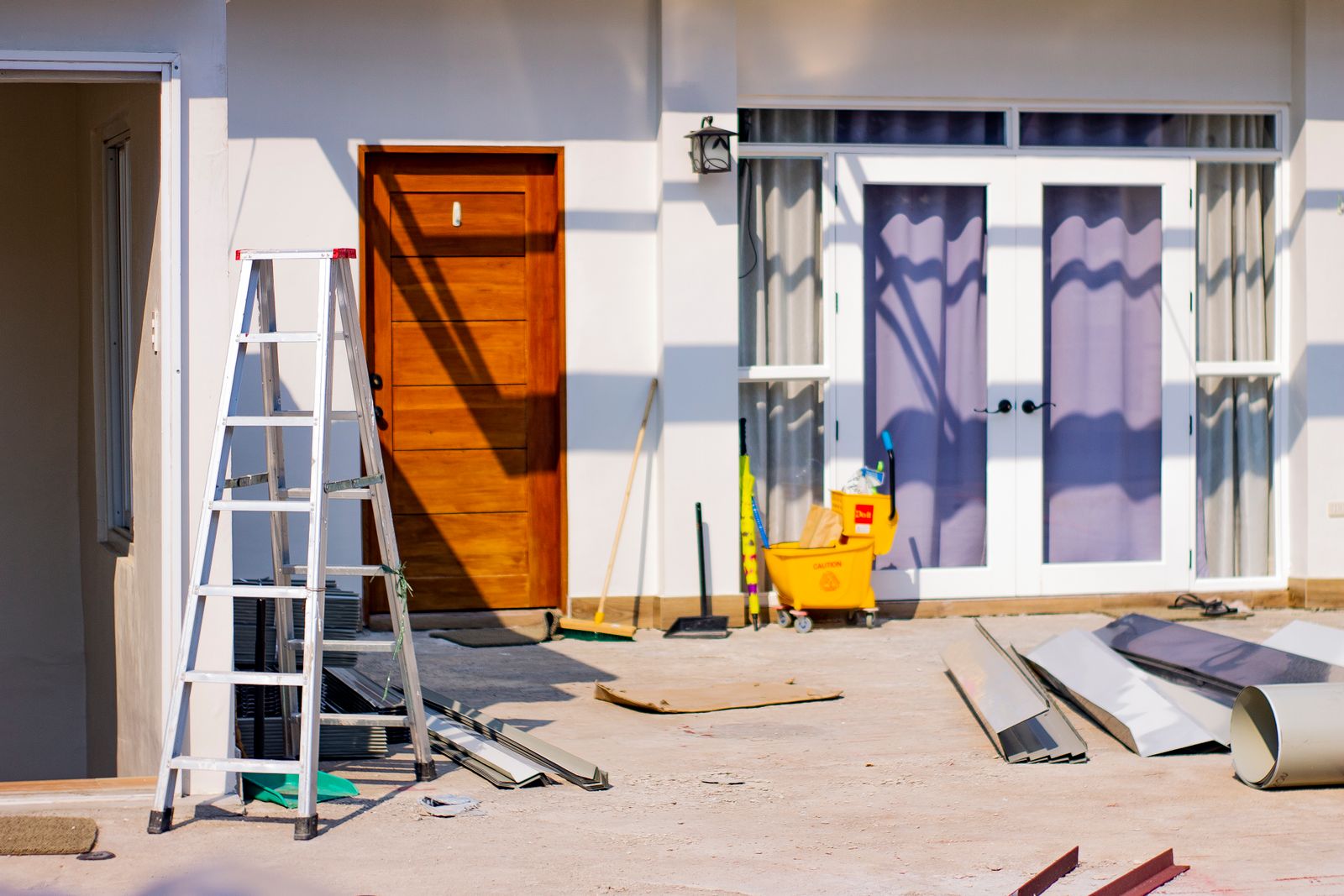 A home exterior being painted