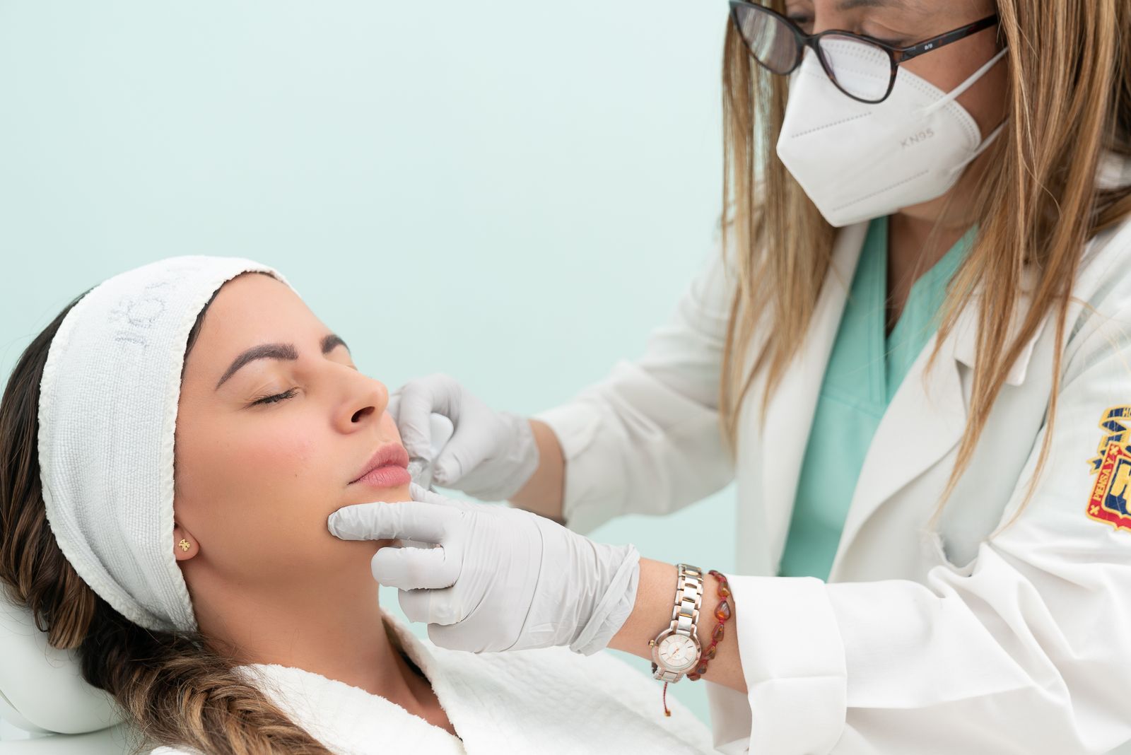 A doctor performing a cosmetic consultation