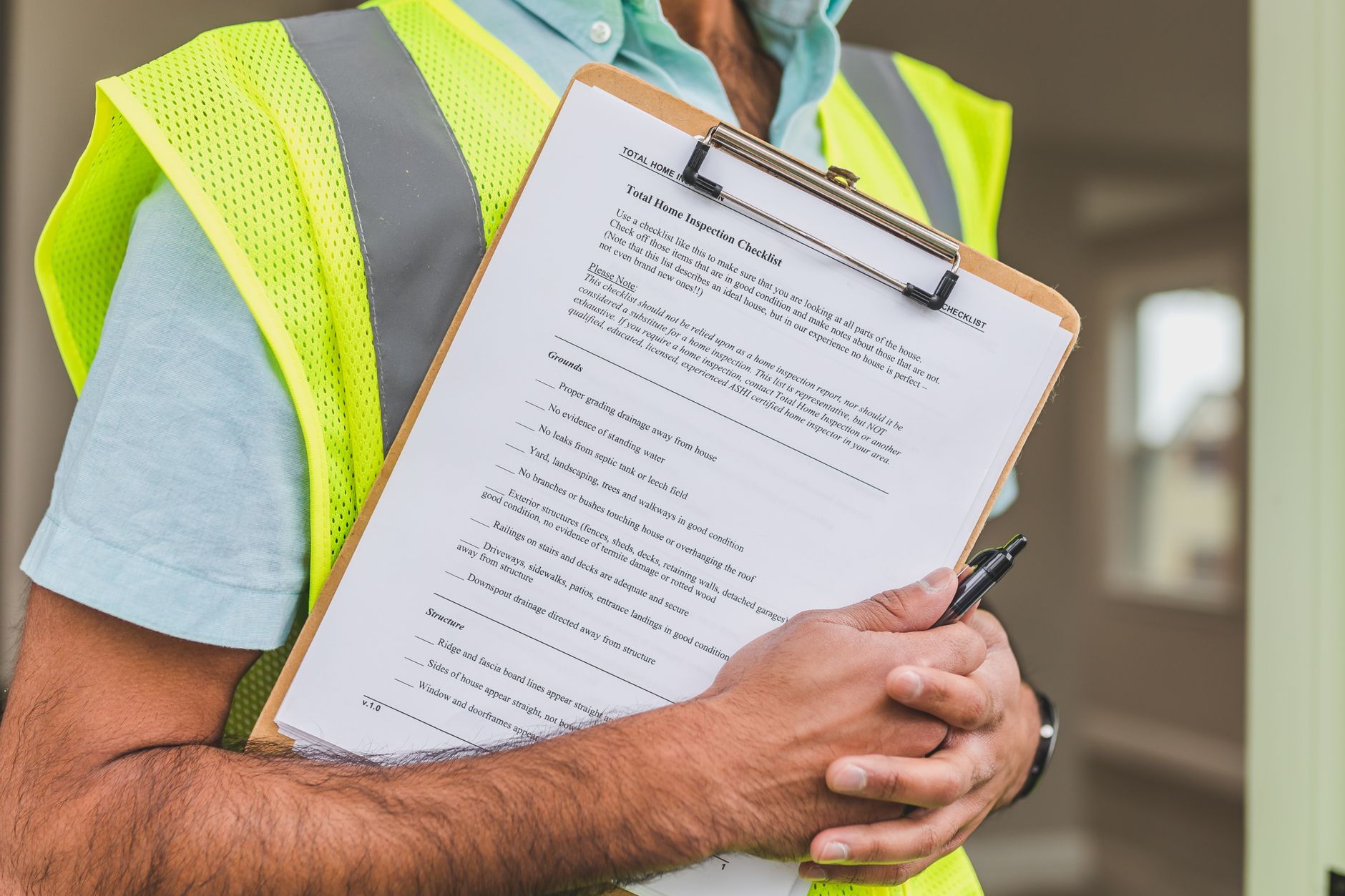 A pest control inspector holding a clipboard checklist