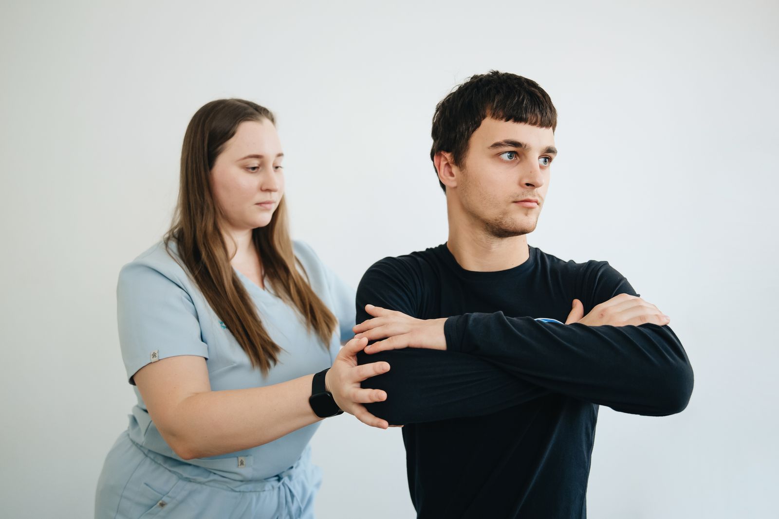 A physiotherapist assisting a patient with rehabilitation exercises