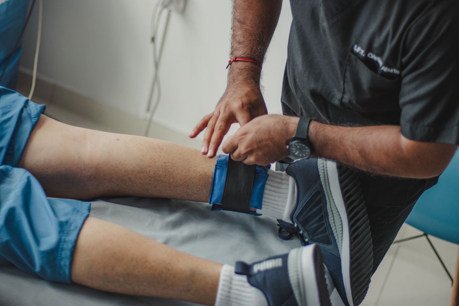 A physiotherapist working with a patient in a clinic