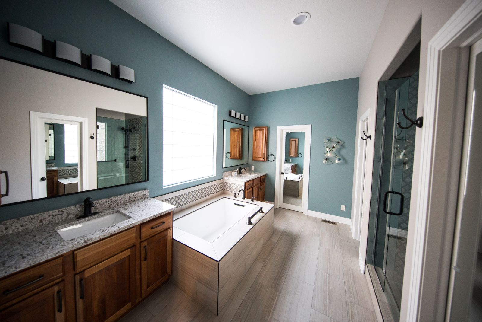 A modern remodeled bathroom with a freestanding tub