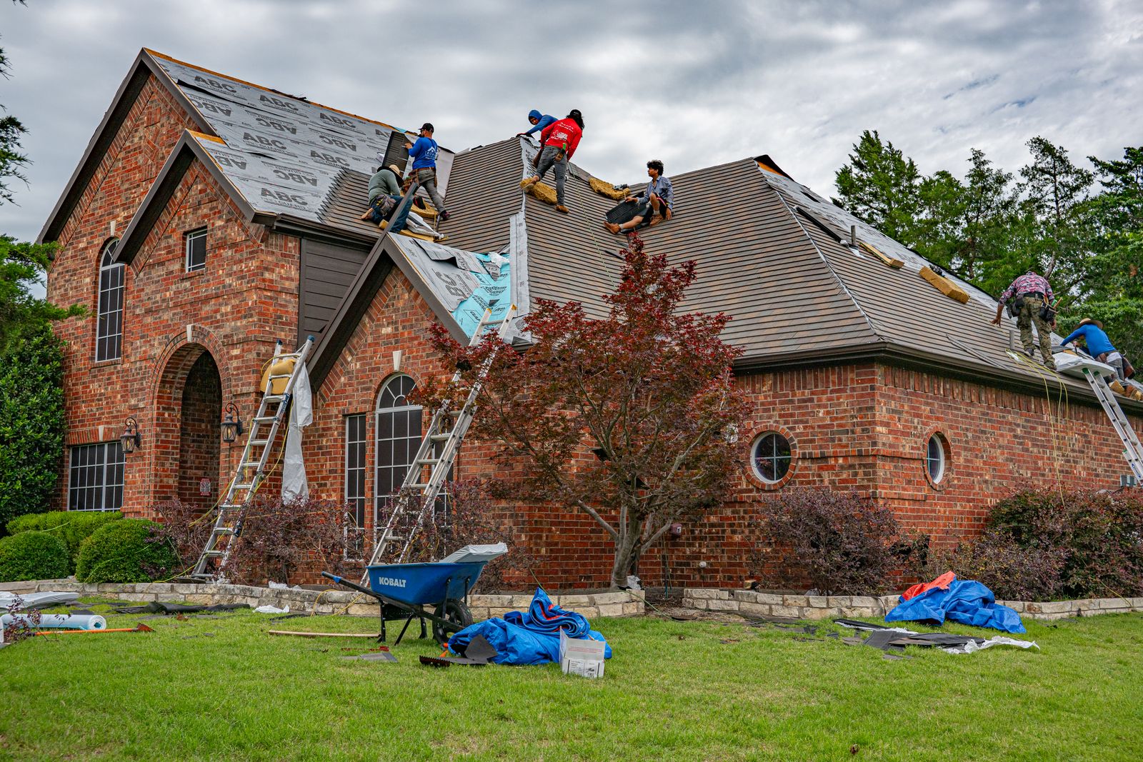 Roofers working on a residential roof