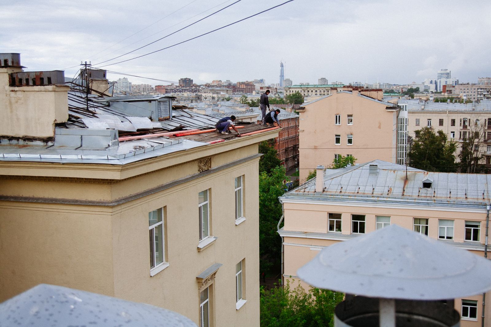 A roofing crew working on a rooftop