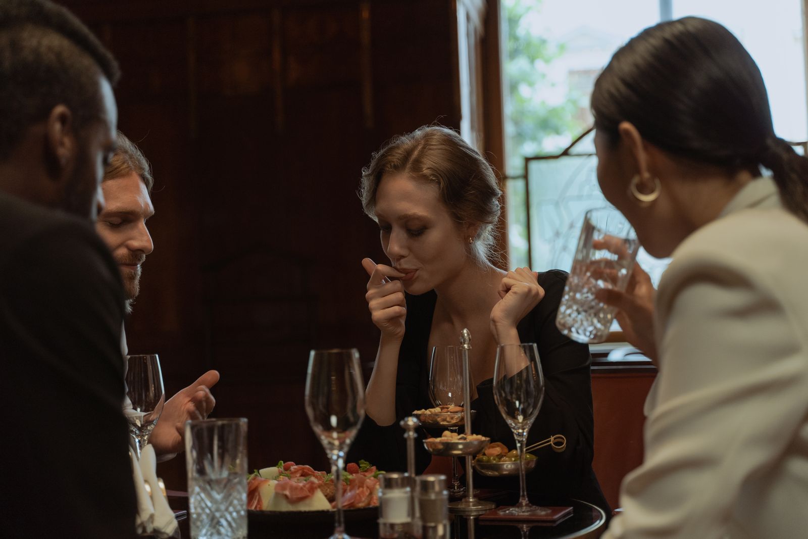 Friends enjoying dinner at a restaurant table