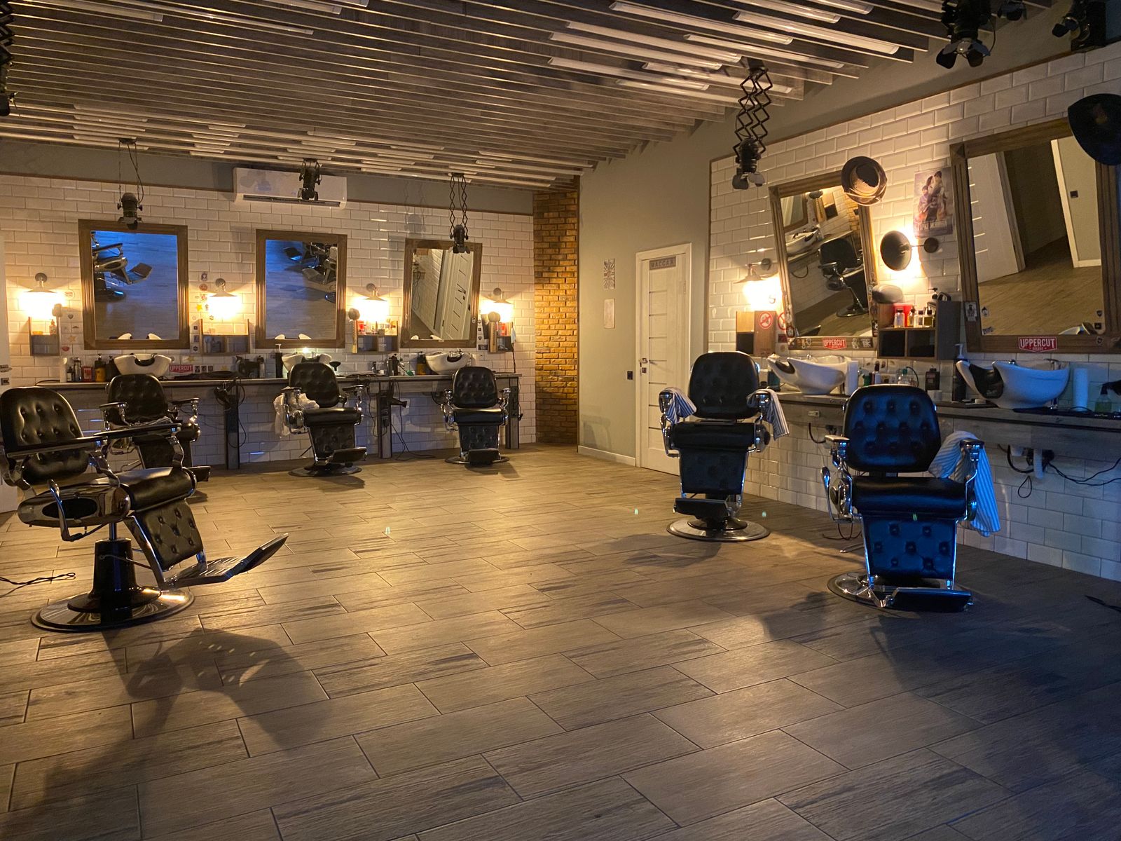 A stylish hair salon with stations and mirrors
