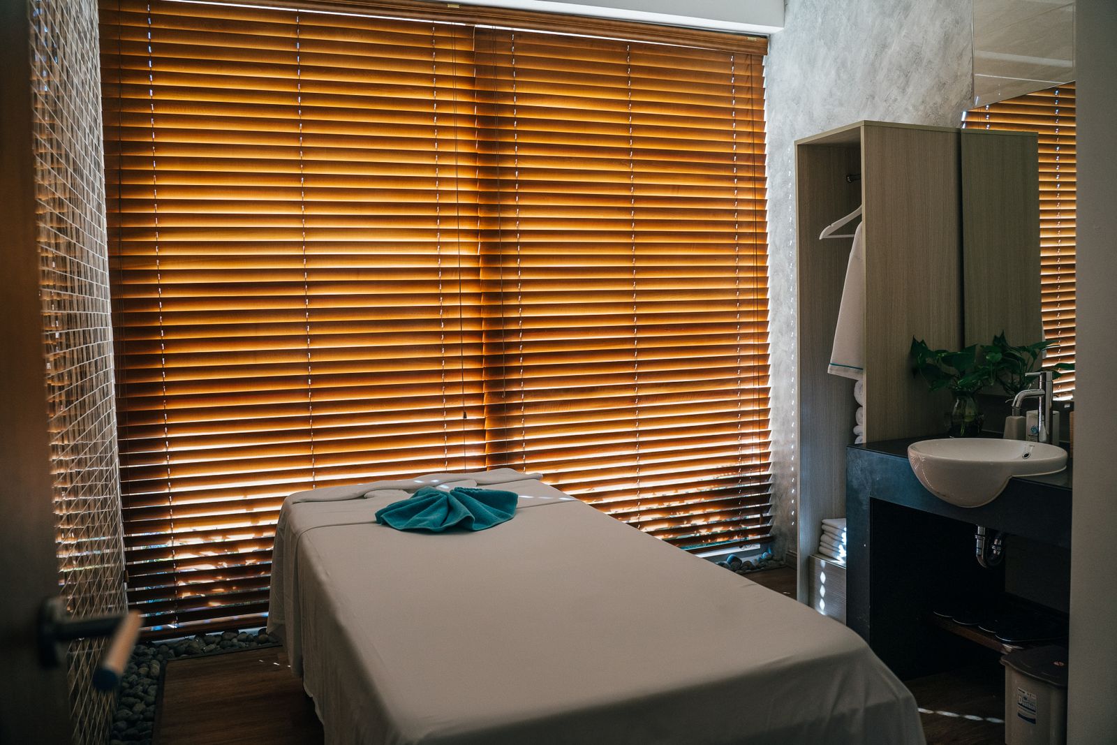 A tranquil spa treatment room with natural light