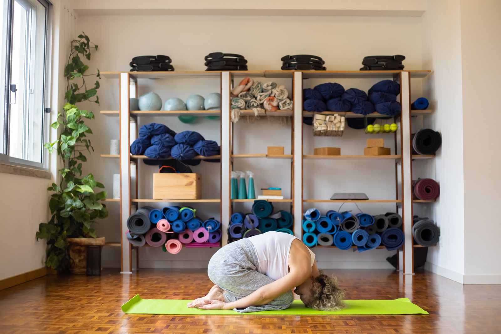 A yoga mat and props in a studio